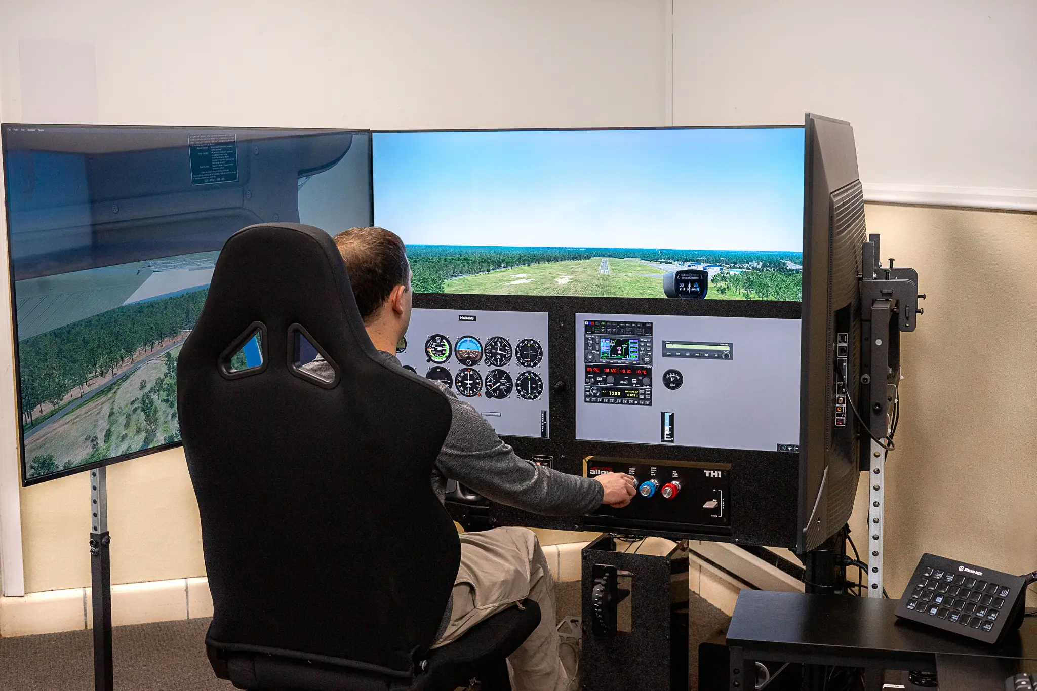 Student using FAA Compliant flight simulator at Solid Ground Aviation